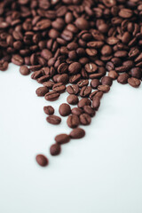 Fresh aromatic roasted coffee beans isolated on white background. Vertical