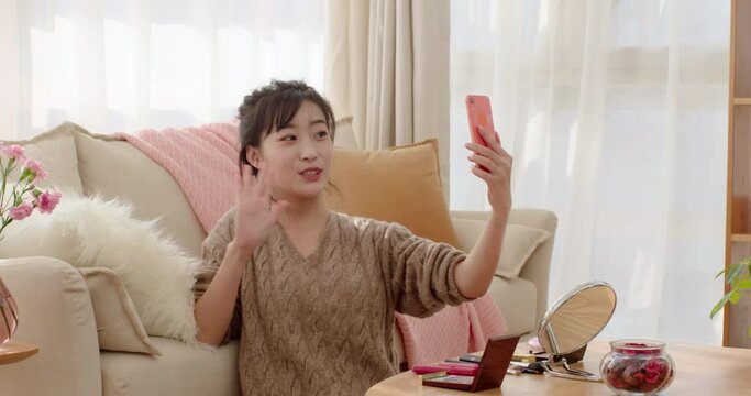 Young woman doing live webcast at home,4K