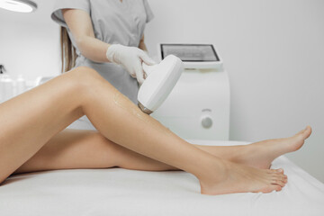 Woman has a laser epilation and cosmetology procedure