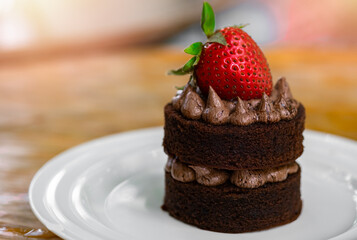 chocolate cake brownie lava and chocolate cream with strawberry on top. homamade cafe bakery  menu concept.
