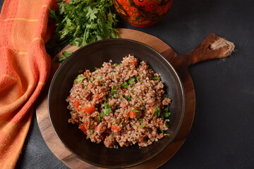 Buckwheat porridge with beef meat and vegetables. Russian cuisine