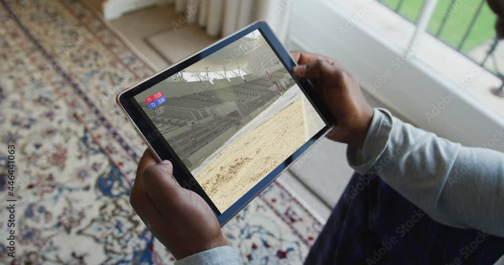 Sticker Composite of man sitting at home, watching athletics long jump event on tablet