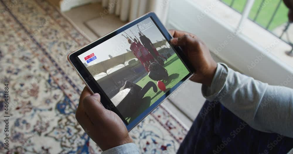 Poster Composite of man sitting at home watching hockey match on tablet