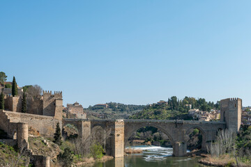Fototapeta premium San Martín Bridge over the Tagus River to enter the monumental city of Toledo.