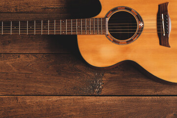 classical guitar on wooden background