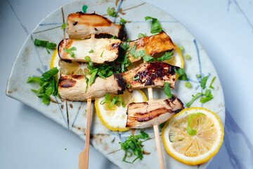 Pleurotus eryngii mushrooms grilled on skewers