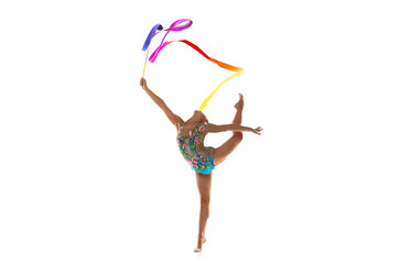 Young beautiful girl, rhythmic gymnast with colored ribbon in motion isolated on white studio...