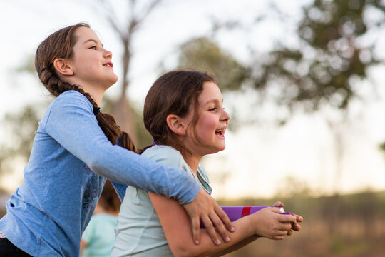 Two children skylarking outdoors