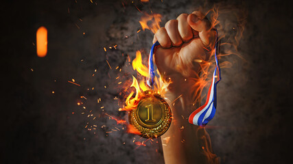 woman hand raised, holding gold medal in the fire. award and victory concept