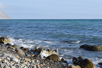 Fototapeta na wymiar Black sea. Beautiful seascape. Pebble beach.