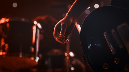 Rock Band Performing at a Concert in a Night Club. Close Up Shot of a Musician Holding and Dropping...