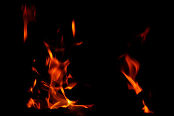 Fototapeta na wymiar Natural flames on a radical black background. Ready for use with Adobe Photoshop in screen mode.
