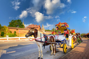 The horse carriage in Lampang at Wat Phra That Lampang Luang , Lampang province in LAMPANG THAILAND.