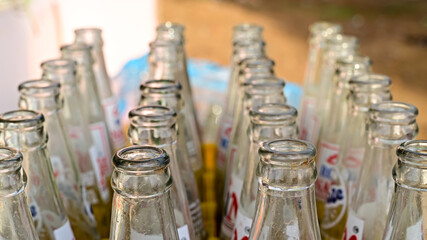 closeup of empty glass soda bottle mouth