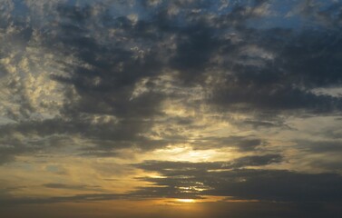 Fototapeta premium Dramatic sunset with dark clouds in the sky, natural background