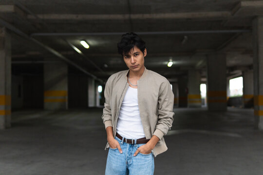 Young latin man in parking lot