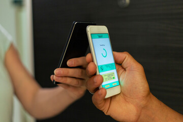 Close-up payment of food delivery with a smart phone