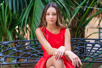 Stylish teen model in red dress