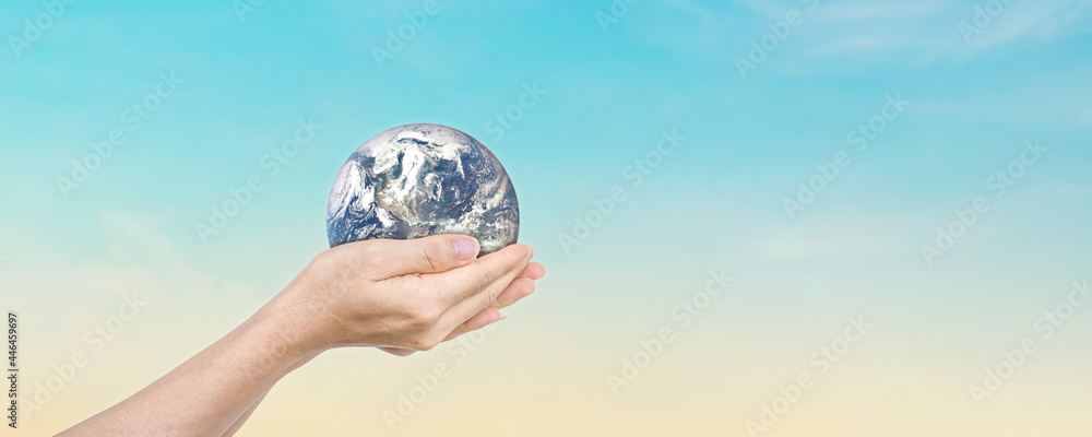 Canvas Prints globe in hands over blue sky background. save of earth. elements of this image furnished by nasa