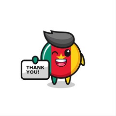 the mascot of the cameroon flag badge holding a banner that says thank you