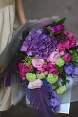 wedding bouquet in the hands of the bride