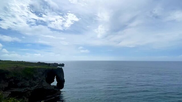 OKINAWA, JAPAN - JUNE 2021 : Cape Manzamo located near Onna son village in the Kunigami District. Wide view time lapse shot in daytime.