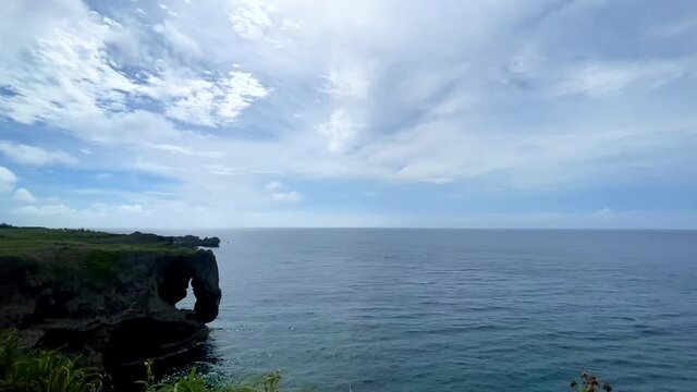 OKINAWA, JAPAN - JUNE 2021 : Cape Manzamo located near Onna son village in the Kunigami District. Wide view time lapse shot in daytime.