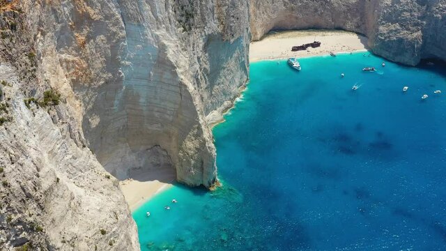 View of Navagio beach, Zakynthos Island, Greece. n. Blue sea water. Rocks and sea. Summer landscape from the air.