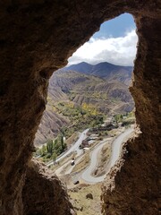 cave mountain village road landscape