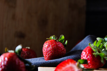 fresh ripe strawberries on wooden board