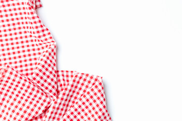 Abstract texture top view fabric red and white checkered isolated on a white background with copy space. Cloth cotton tablecloth for menu food restaurants.