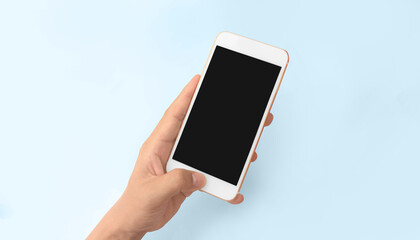 Hand holding smartphone device touching screen