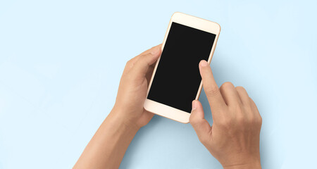 Hand holding smartphone device touching screen