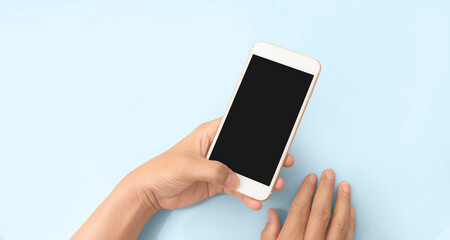 Hand holding smartphone device touching screen