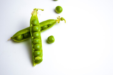 Peas against white background. Vertical photo of polka dots.