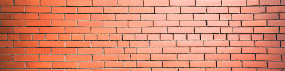 Panoramic view of empty red brick wall of building outdoor