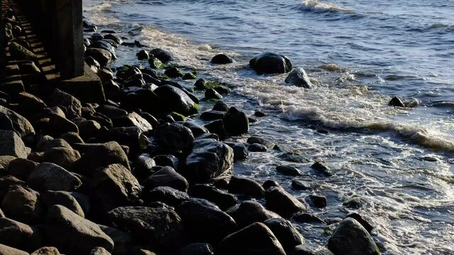 the waves of the baltic sea hitting the stones