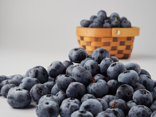 Blueberry fruit top view isolated on a white background, flat lay overhead layout with mint leaf, healthy design concept.