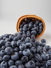 Blueberry fruit top view isolated on a white background, flat lay overhead layout with mint leaf, healthy design concept.