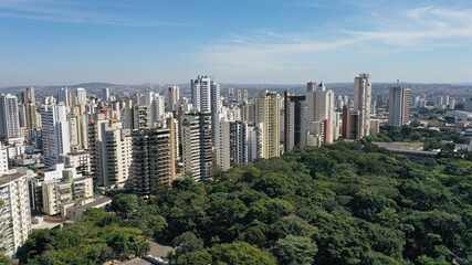 Aerial view of a beautiful park with tropical nature in Goiania surrounded by  residential buildings. Goiania, Goias, Brazil 