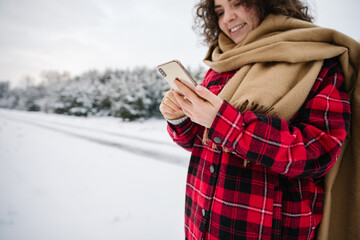 Happy Girl In Red Jachet The Snow Forest. Cold Winter. Cup of tea.