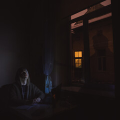 solitude feeling by lonely man overworking on kithcen and dream at night with shadow effect