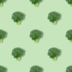 Seamless pattern with broccoli on a green background. Vegetable pattern. Summer abstract background.