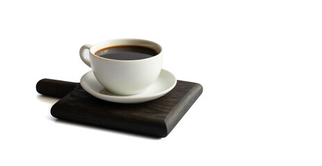 Cup of hot black coffee isolated on a white background. Black coffee in small cup on wooden board. Copy space.