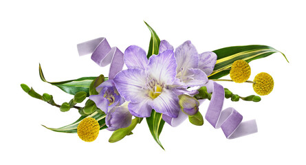 Purple freesia flowers and green leaves with velvet ribbon in a floral arrangement isolated