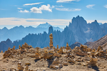 Stones gravel stack bellow Alpine mountain summit. Spring trail around Tre Cime di Lavaredo, well...