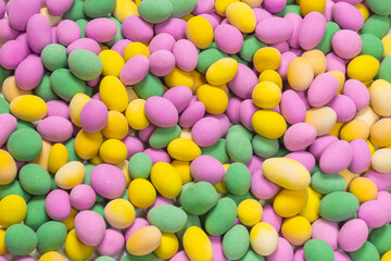 Group of colorful peanuts in glaze.