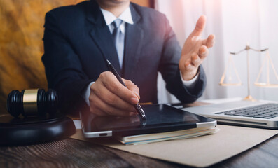 justice and law concept.Male judge in a courtroom on wooden table and Counselor or Male lawyer...