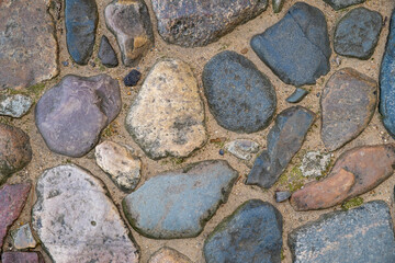 Close-up of stones laid on the pavement