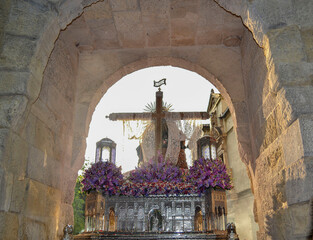 reverse of the image Santa María de la Alhambra surrounded by violet flowers entering through the...
